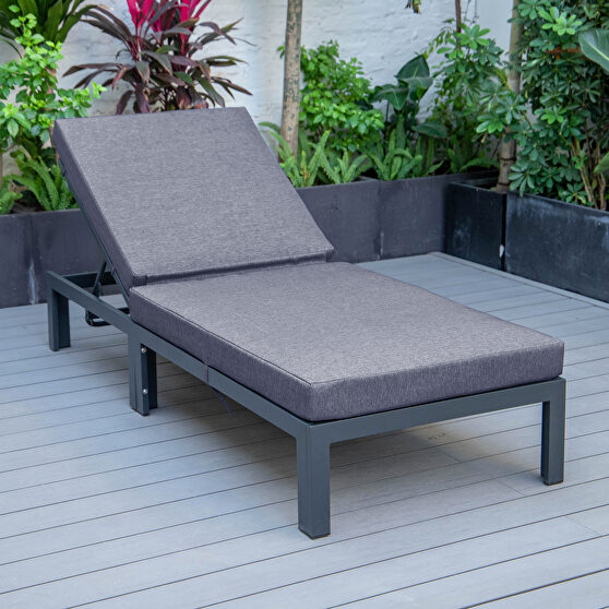 Modern outdoor chaise lounge chair with blue cushions
