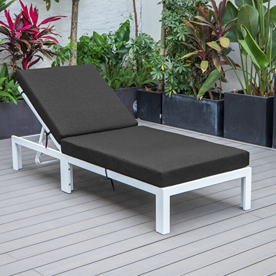 Modern outdoor white chaise lounge chair with black cushions