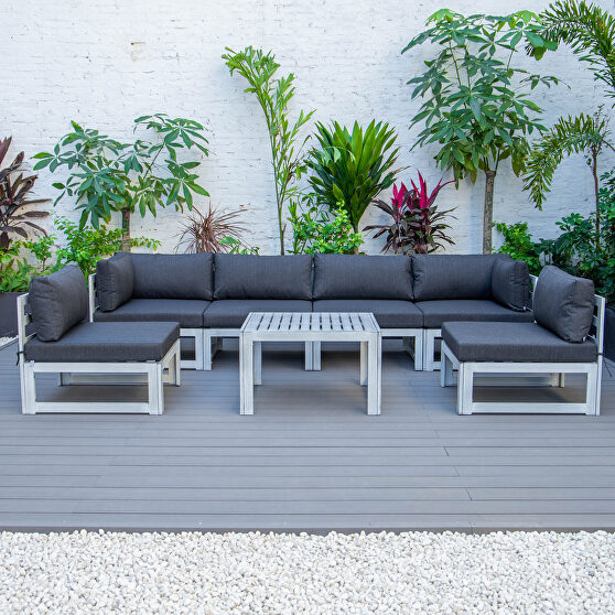 Black finish cushions 7-piece patio sectional and coffee table set in weathered gray aluminum