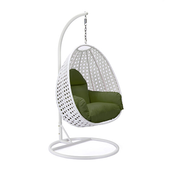 Dark green cushion and white wicker hanging egg swing chair