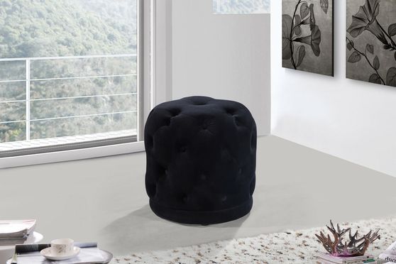 Black velvet tufted round ottoman