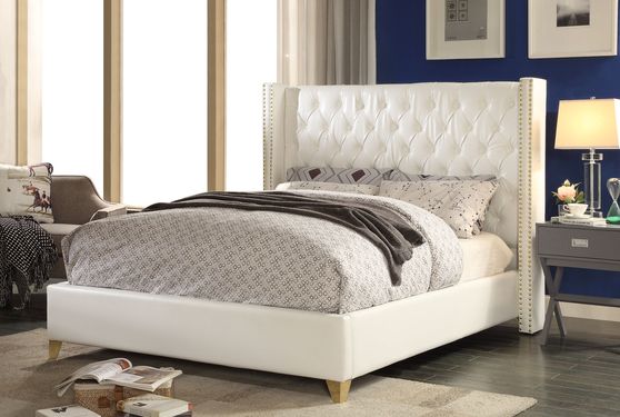 White tufted bonded leather wing design king bed