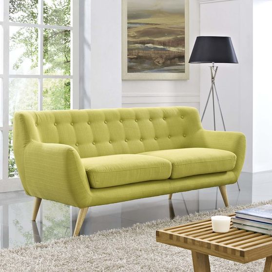 Mid-century style tufted retro couch in wheatgrass