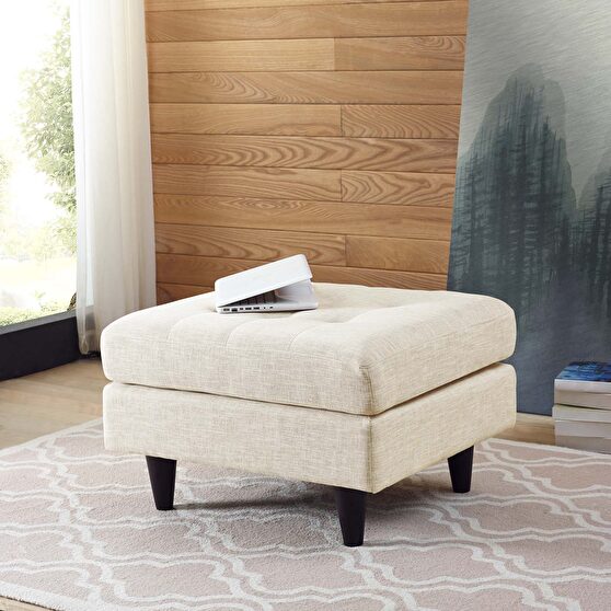 Upholstered fabric ottoman in beige