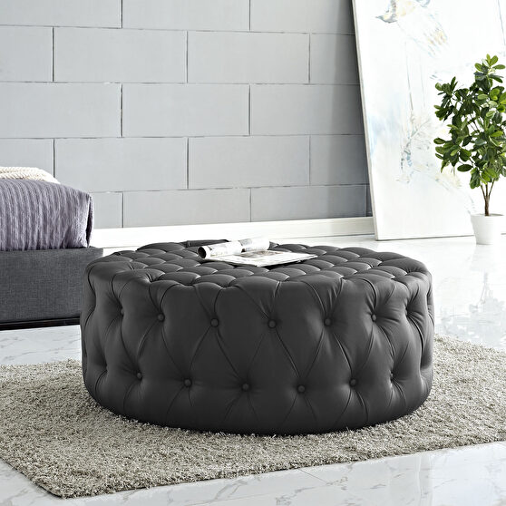 Upholstered vinyl ottoman in black