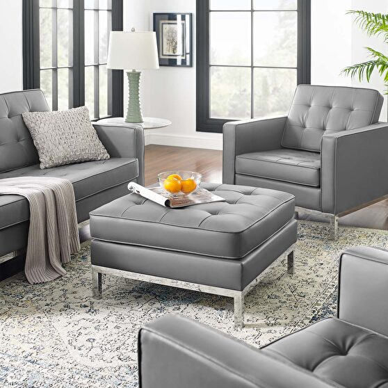 Tufted upholstered faux leather ottoman in silver gray