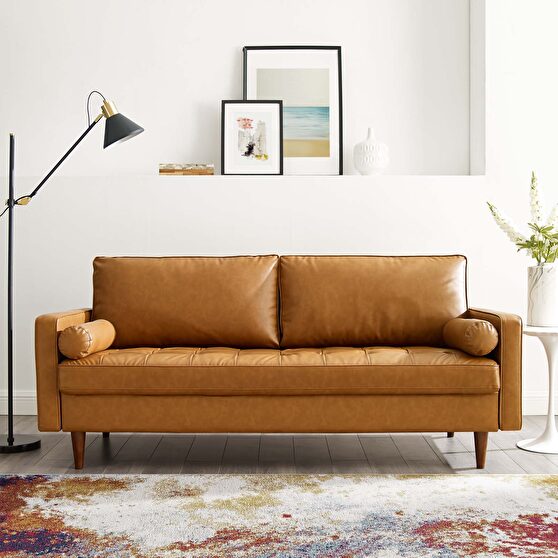 Upholstered faux leather sofa in tan