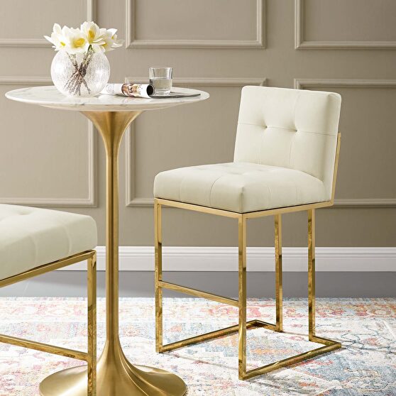 Gold stainless steel performance velvet bar stool in gold ivory