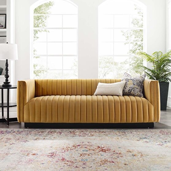 Channel tufted velvet sofa in cognac