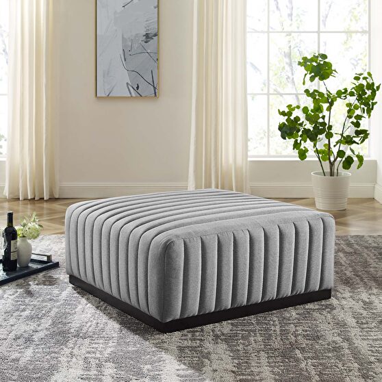 Channel tufted performance velvet ottoman in black/ light gray