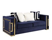 Blue velvet upholstery and gold detail on the base loveseat