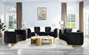 Black velvet upholstery and gold detail on the base sofa