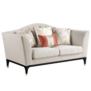 Beige velvet upholstery sophisticated curves and crystal-like button tufting loveseat