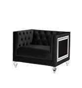Black velvet upholstery and button tufted mirrored trim accent chair