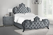 High curved headboard bed upholstered in a gray velvet main photo