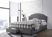 Queen storage bed upholstered in a charcoal fabric