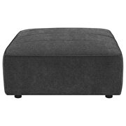 Upholstered square ottoman in dark charcoal fabric