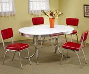 Chrome plated oval retro style white table w/ red chairs