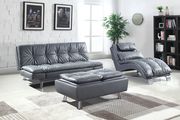 Casual modern sofa bed in gray leatherette