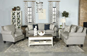 Gray woven fabric upholstery and antique brass finish nailhead sofa