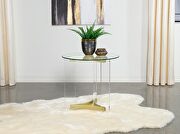 Round glass top end table with acrylic legs clear and matte brass