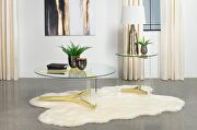 Round glass top coffee table with acrylic legs clear and matte brass