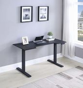 Power adjustable desk in black main photo