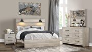 White wash queen bed in with lamps in rustic transitional style main photo