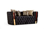 Button tufted loveseat with velvet fabric and gold accent in black