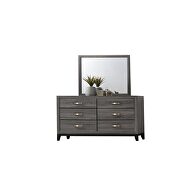 Clean midcentury lines and a gray rustic finish dresser