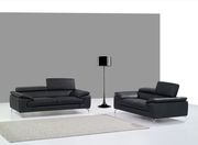 Black Italian leather sofa w/ adjustable headrests