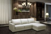 Cream leather sectional w/ sleeper and storage