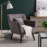 Gray upholstery accenting chair with pillow