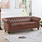 Brown pu uphostery rolled arm chesterfield three seater sofa main photo