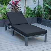 Modern outdoor chaise lounge chair with black cushions main photo