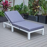 Modern outdoor white chaise lounge chair with blue cushions main photo