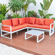 Orange cushions and white base sectional with adjustable headrest & coffee table main photo