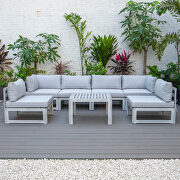 Light gray finish cushions 7-piece patio sectional and coffee table set in weathered gray aluminum main photo