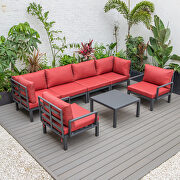 7-piece aluminum patio conversation set with coffee table and red cushions main photo