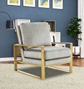 Beautiful gold legs and luxe soft cushions chair in light gray main photo