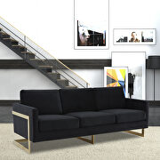 Modern mid-century upholstered midnight black velvet sofa with gold frame main photo