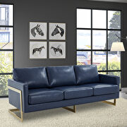 Modern mid-century upholstered navy blue leather sofa with gold frame main photo