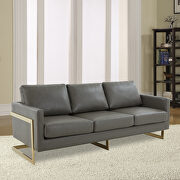 Modern mid-century upholstered gray leather sofa with gold frame main photo