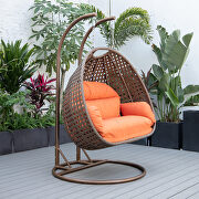 Orange cushion and dark brown wicker hanging 2 person egg swing chair main photo