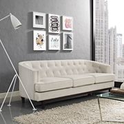 Tufted back mid-century style beige fabric sofa