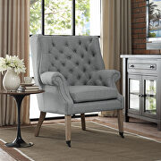 Upholstered fabric lounge chair in light gray
