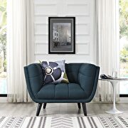 Upholstered fabric armchair in blue