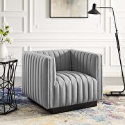 Tufted upholstered fabric armchair in light gray