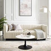 Tufted upholstered fabric sofa in beige