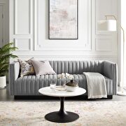 Tufted upholstered fabric sofa in light gray